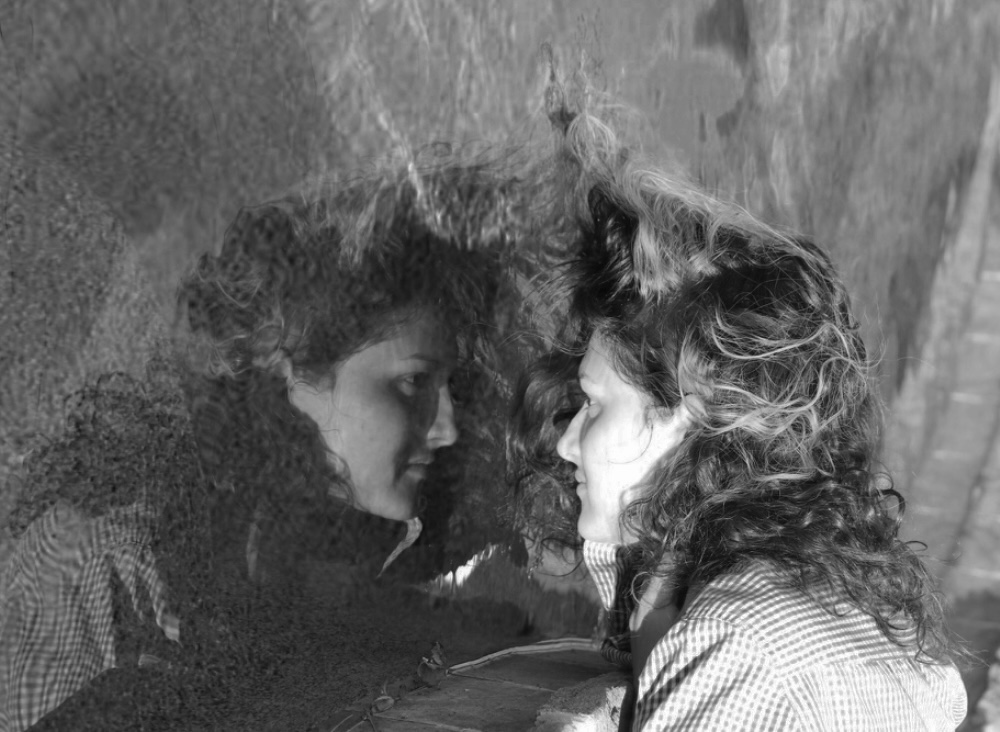 I look through my reflection in water